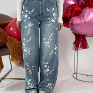 JEANS FIORI BIANCHI IN RILIEVO